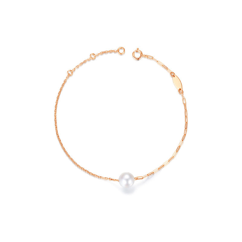 Luna Blanco - gold chain and akoya pearl bracelet.